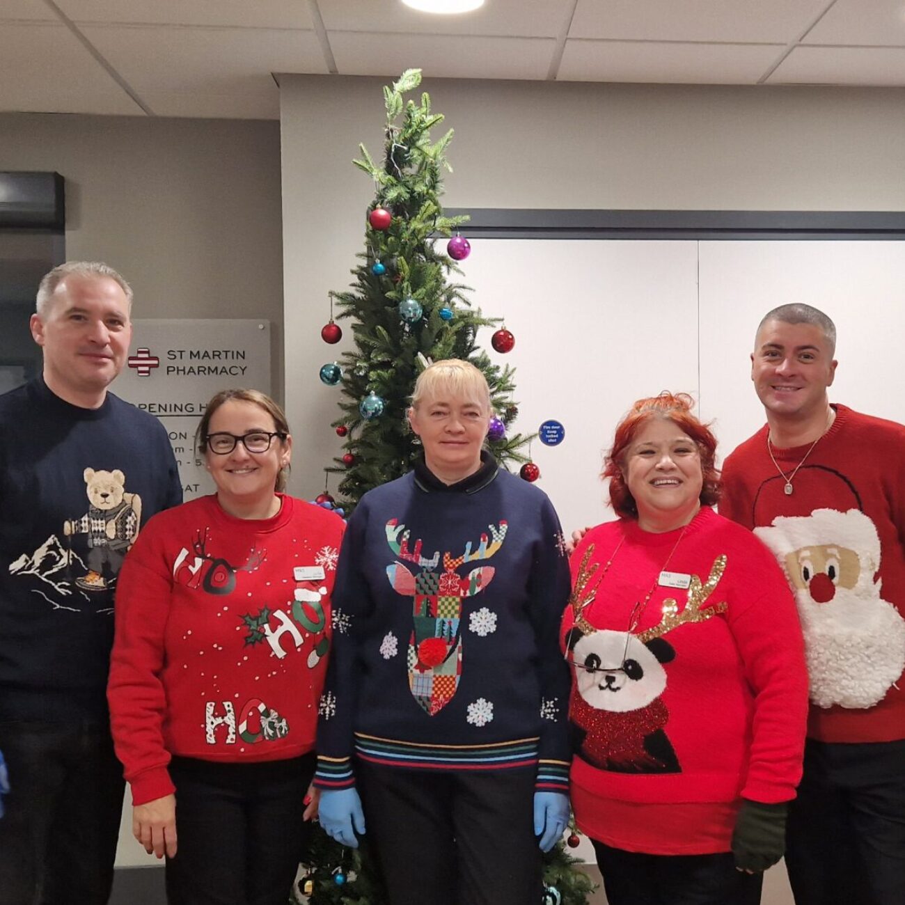 The team in their Christmas jumpers